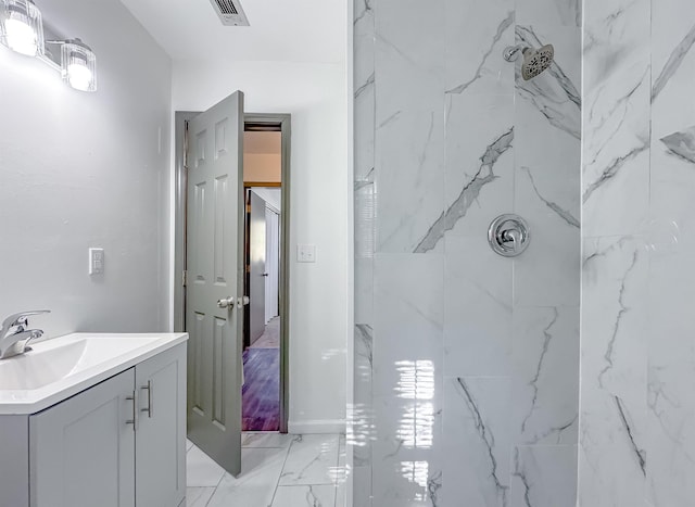 full bathroom with a marble finish shower, visible vents, marble finish floor, and vanity