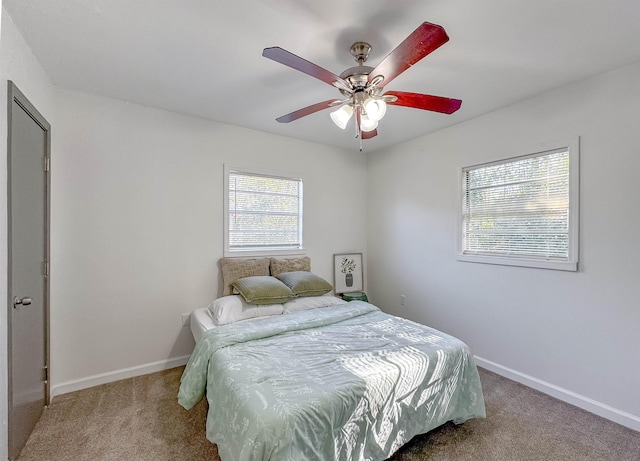 bedroom featuring carpet flooring, ceiling fan, and baseboards