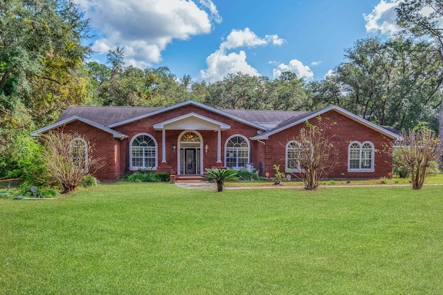 ranch-style house featuring a front lawn