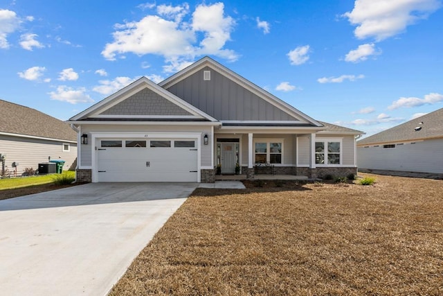 craftsman inspired home featuring cooling unit, a garage, and a porch