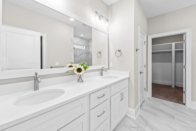 bathroom featuring an enclosed shower and vanity