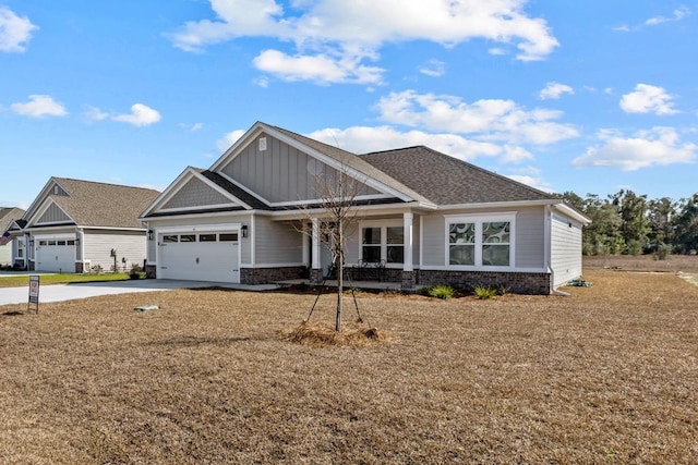 craftsman-style home featuring a garage and a front yard