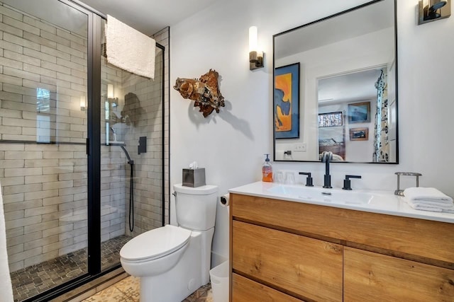 bathroom with tile patterned floors, vanity, toilet, and an enclosed shower