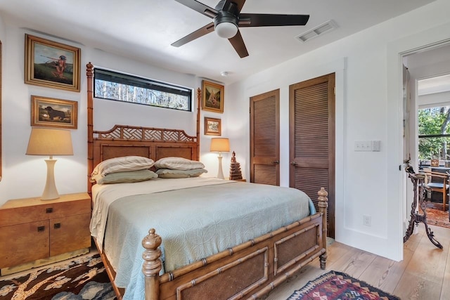 bedroom featuring light hardwood / wood-style floors and ceiling fan