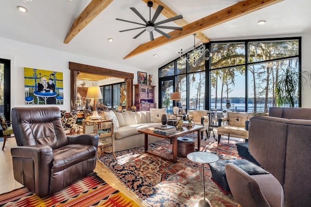 living room with beamed ceiling, a water view, high vaulted ceiling, and ceiling fan