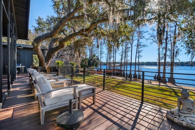 wooden deck with a water view