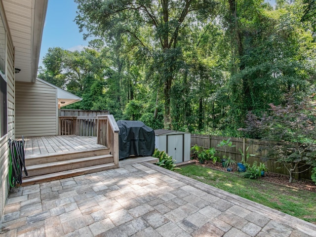 7214 Jaffrey Ct, Tallahassee, FL 32312 - fenced backyard with a patio, a wooden deck, and a grill