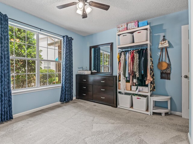 7214 Jaffrey Ct, Tallahassee, FL 32312 - carpeted bedroom with a textured ceiling, a closet, baseboards, and a ceiling fan