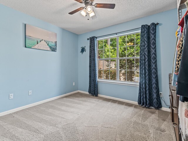 7214 Jaffrey Ct, Tallahassee, FL 32312 - unfurnished room with a textured ceiling, ceiling fan, carpet, and baseboards
