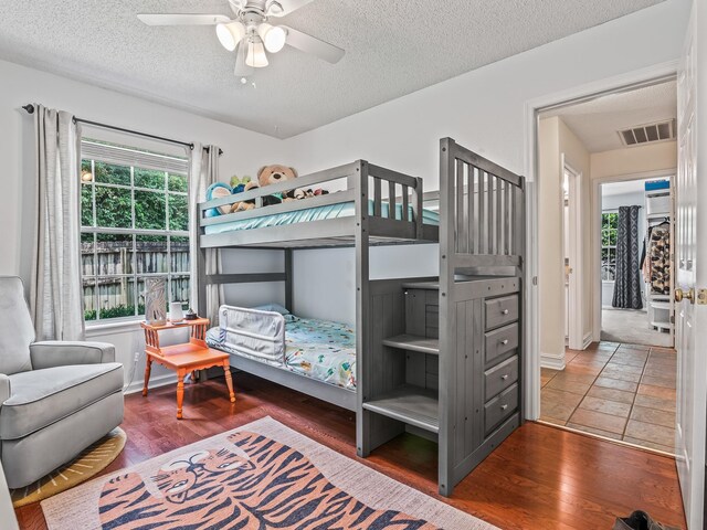 7214 Jaffrey Ct, Tallahassee, FL 32312 - bedroom featuring a textured ceiling, wood finished floors, and a ceiling fan