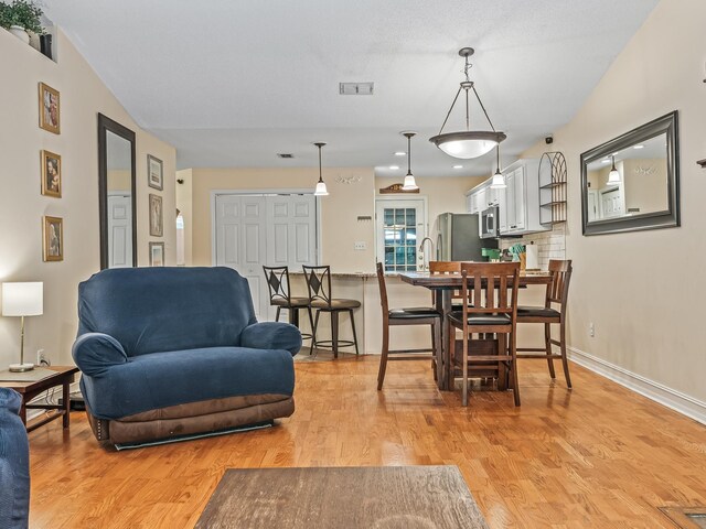 7214 Jaffrey Ct, Tallahassee, FL 32312 - dining room with light wood-type flooring and baseboards