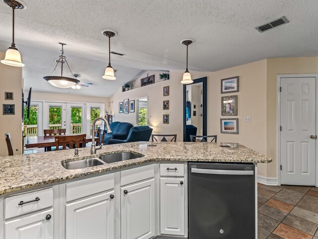 7214 Jaffrey Ct, Tallahassee, FL 32312 - kitchen featuring dishwasher, a sink, lofted ceiling, a textured ceiling, and french doors