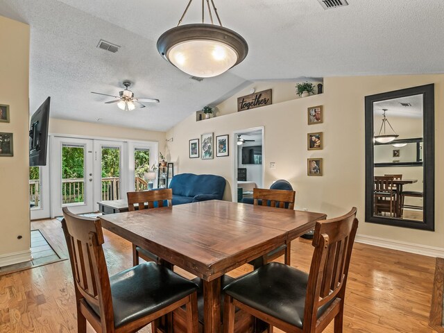 7214 Jaffrey Ct, Tallahassee, FL 32312 - dining area featuring lofted ceiling, a ceiling fan, light wood-style flooring, baseboards, and a textured ceiling