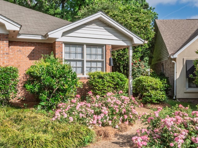 exterior space with brick siding