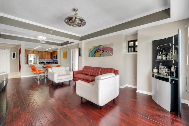 121 N Monroe St Unit 1207, Tallahassee, FL 32301 - living room featuring a tray ceiling, wood finished floors, and crown molding