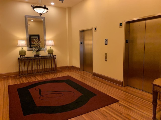 121 N Monroe St Unit 1207, Tallahassee, FL 32301 - hallway with elevator, wood finished floors, and recessed lighting