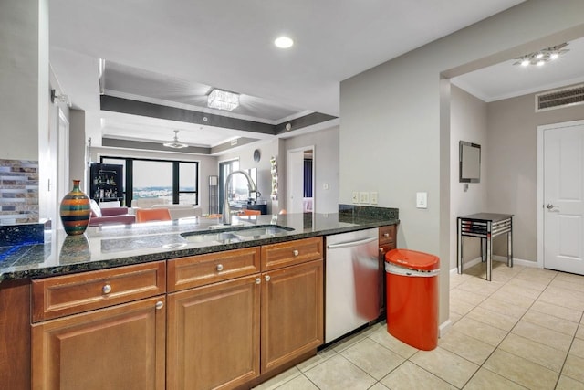 121 N Monroe St Unit 1207, Tallahassee, FL 32301 - kitchen with dishwasher, ornamental molding, brown cabinets, dark stone counters, and a tray ceiling