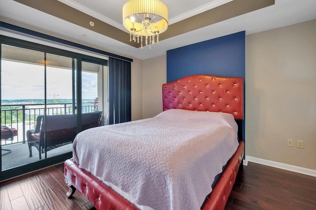 121 N Monroe St Unit 1207, Tallahassee, FL 32301 - bedroom with access to exterior, a chandelier, crown molding, a tray ceiling, and wood finished floors