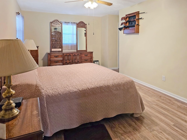 bedroom featuring ceiling fan and light wood-type flooring