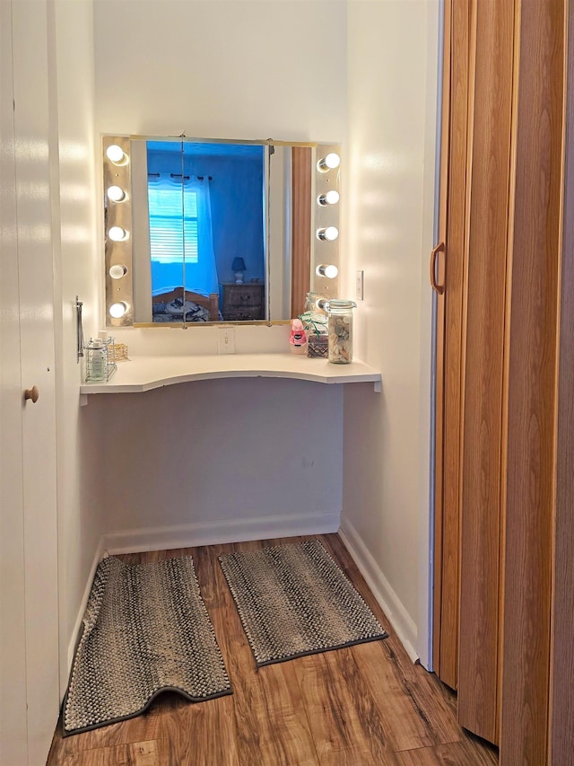 bathroom with hardwood / wood-style flooring