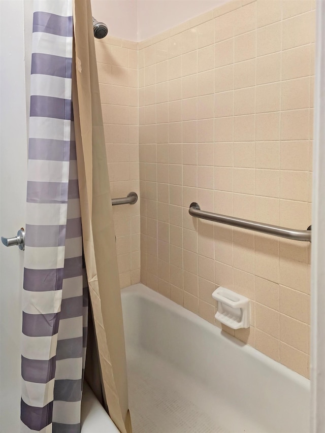 bathroom featuring shower / bath combination with curtain