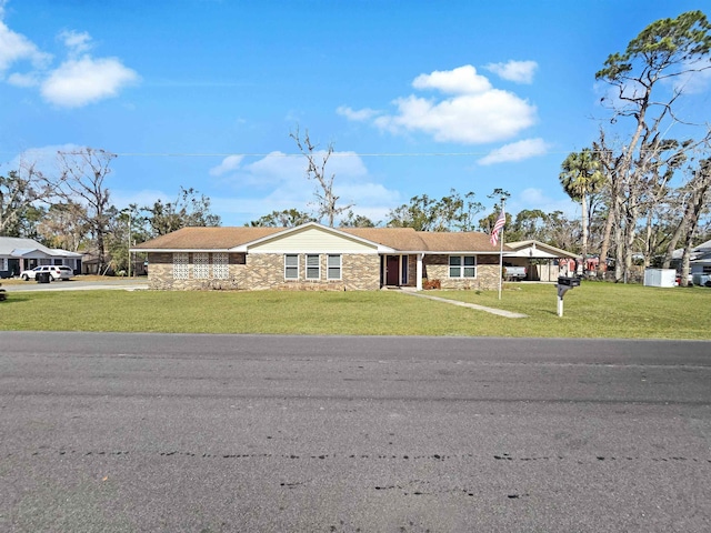 ranch-style home with a front yard