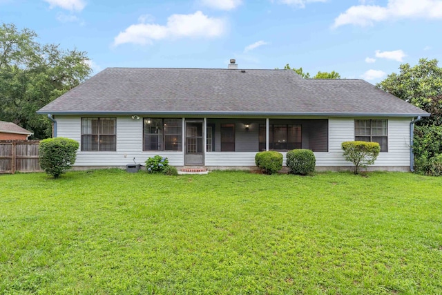 1989 Setting Sun Trl, Tallahassee, FL 32303 - view of front of home with a shingled roof, a chimney, and a sunroom