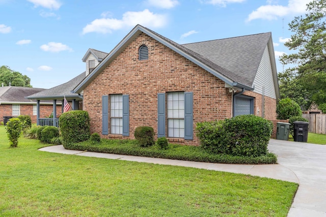 1989 Setting Sun Trl, Tallahassee, FL 32303 - view of side of property with brick siding, roof with shingles, and driveway