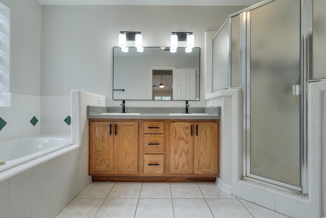 1989 Setting Sun Trl, Tallahassee, FL 32303 - bathroom featuring a stall shower, double vanity, a garden tub, and tile patterned flooring