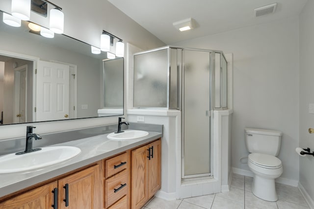 1989 Setting Sun Trl, Tallahassee, FL 32303 - bathroom with double vanity, a stall shower, and tile patterned flooring