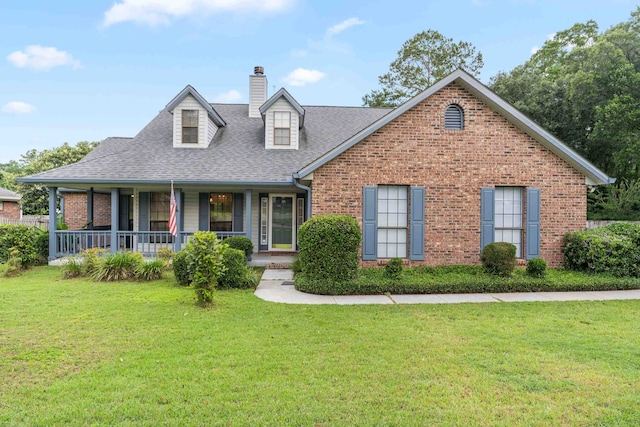1989 Setting Sun Trl, Tallahassee, FL 32303 - view of front facade with a chimney, a shingled roof, brick siding, and a front lawn