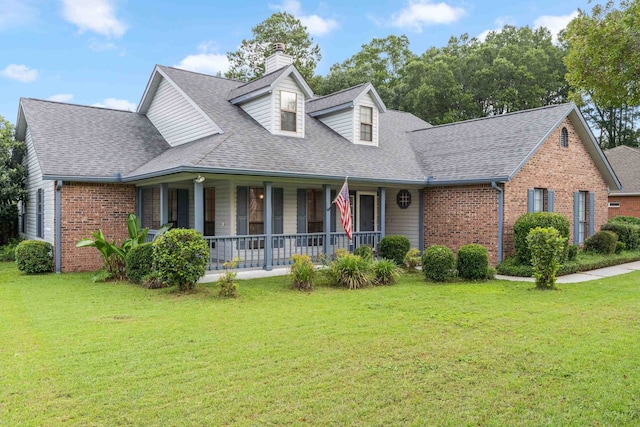 1989 Setting Sun Trl, Tallahassee, FL 32303 - cape cod home with a porch, brick siding, a chimney, and a front lawn