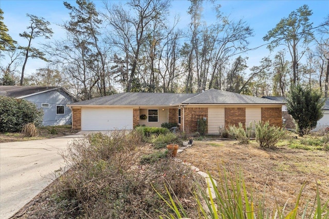 ranch-style house with a garage, concrete driveway, and brick siding