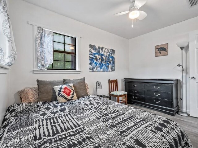 12 Lake Essay Dr, Panacea, FL 32346 - bedroom with wood finished floors and a ceiling fan