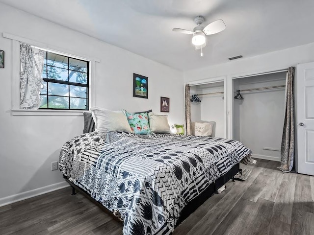 12 Lake Essay Dr, Panacea, FL 32346 - bedroom with multiple closets, wood finished floors, baseboards, and ceiling fan