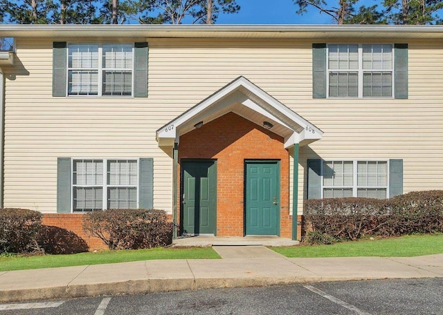 view of front of home featuring brick siding