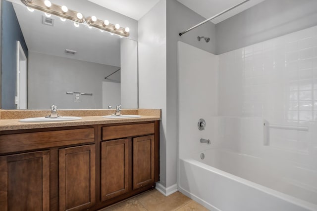 2400 Fred Smith Rd Unit 202, Tallahassee, FL 32303 - bathroom featuring washtub / shower combination, tile patterned flooring, and double vanity