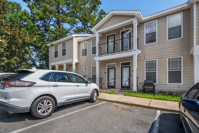 2400 Fred Smith Rd Unit 202, Tallahassee, FL 32303 - townhome / multi-family property with a balcony and uncovered parking