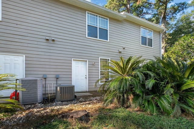 back of property featuring central air condition unit