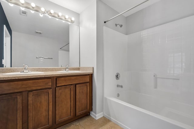 bathroom with washtub / shower combination, tile patterned floors, and vanity