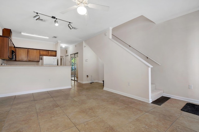 unfurnished living room with ceiling fan, crown molding, and light tile patterned floors