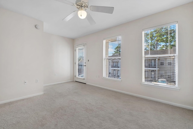 carpeted empty room with ceiling fan