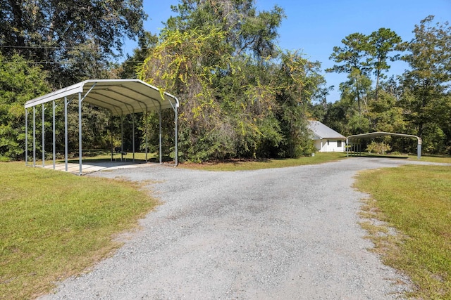 view of road with gravel driveway
