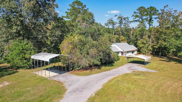 bird's eye view with a wooded view