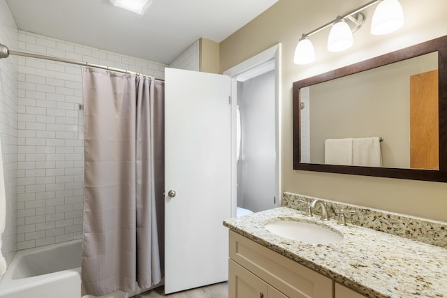 bathroom with shower / tub combo with curtain and vanity