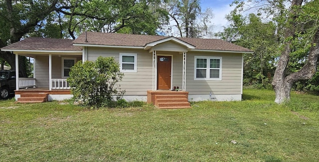 bungalow-style house featuring covered porch, crawl space, and a front yard