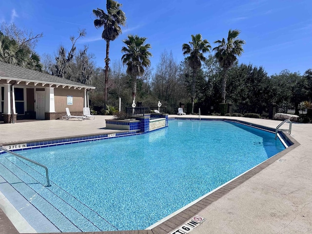 community pool with a patio area