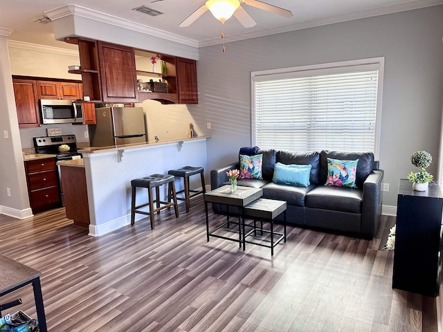 living area with dark wood-style flooring, visible vents, ornamental molding, a ceiling fan, and baseboards