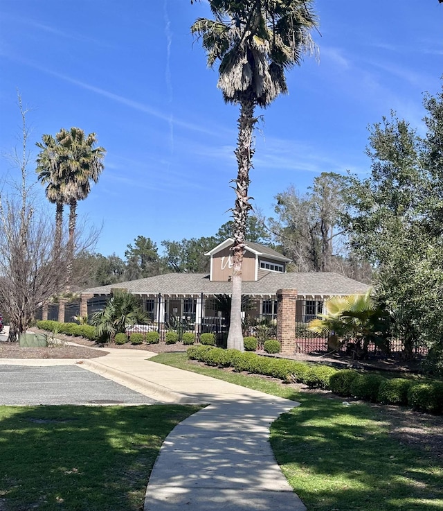 view of property featuring fence