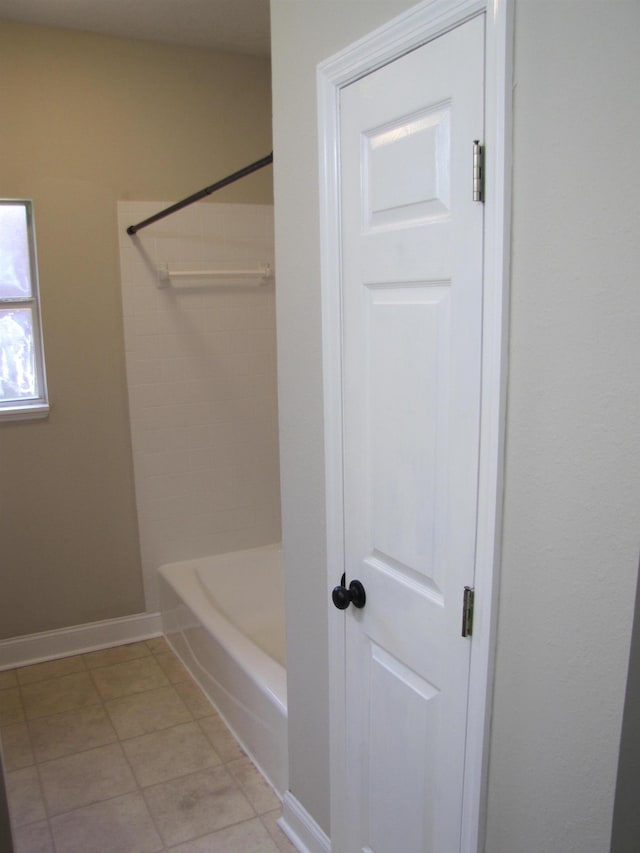 bathroom featuring bathtub / shower combination and tile patterned floors